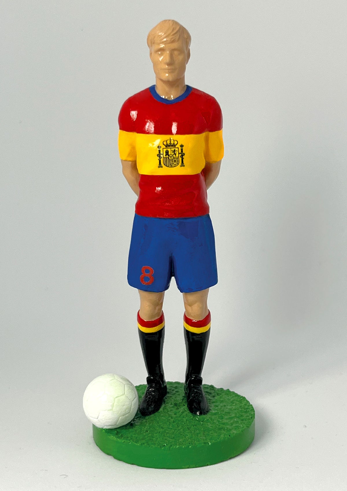 Figurine de collection Match Day FC équipe d'Espagne, maillot rouge et jaune au blason, gros plan de face.