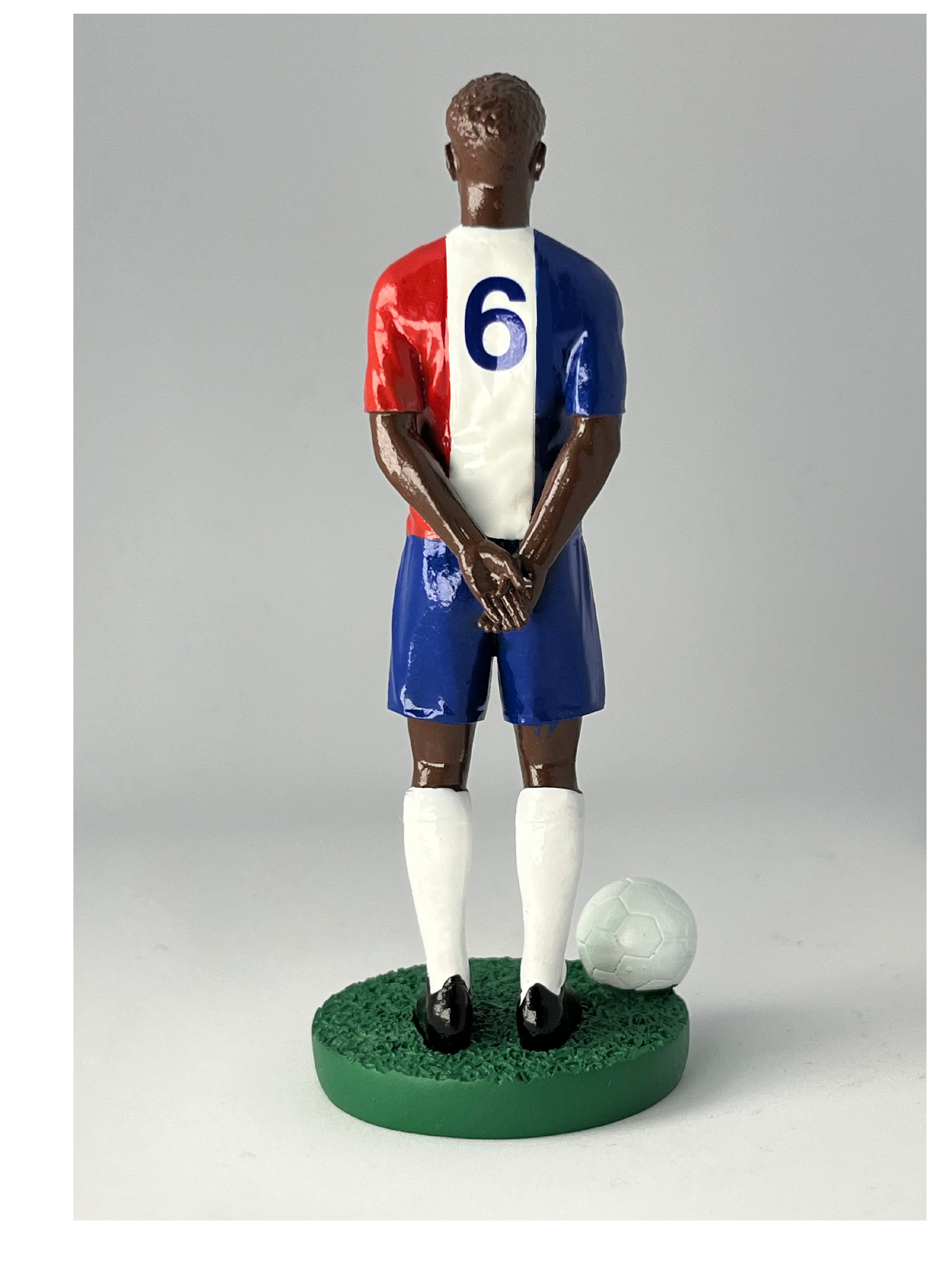 Figurine de collection Match Day FC équipe de France (n°6), maillot bleu blanc rouge au coq doré, vue de dos.